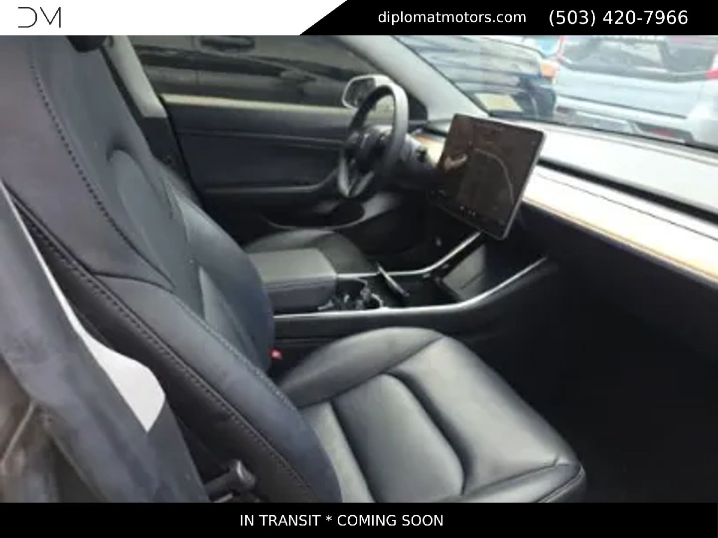 The dashboard and touchscreen inside a Tesla Model 3