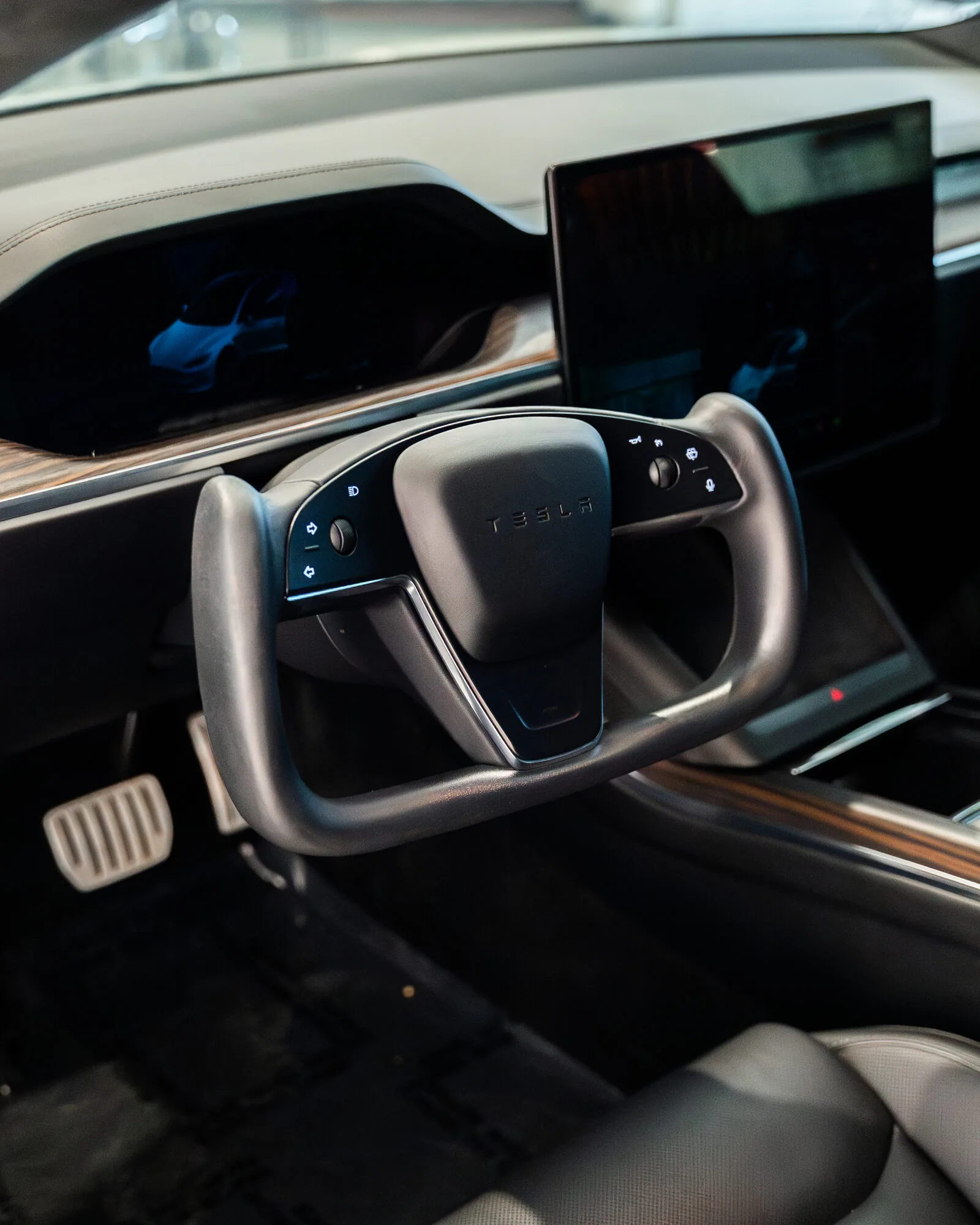 The yoke steering wheel inside a Tesla Model S
